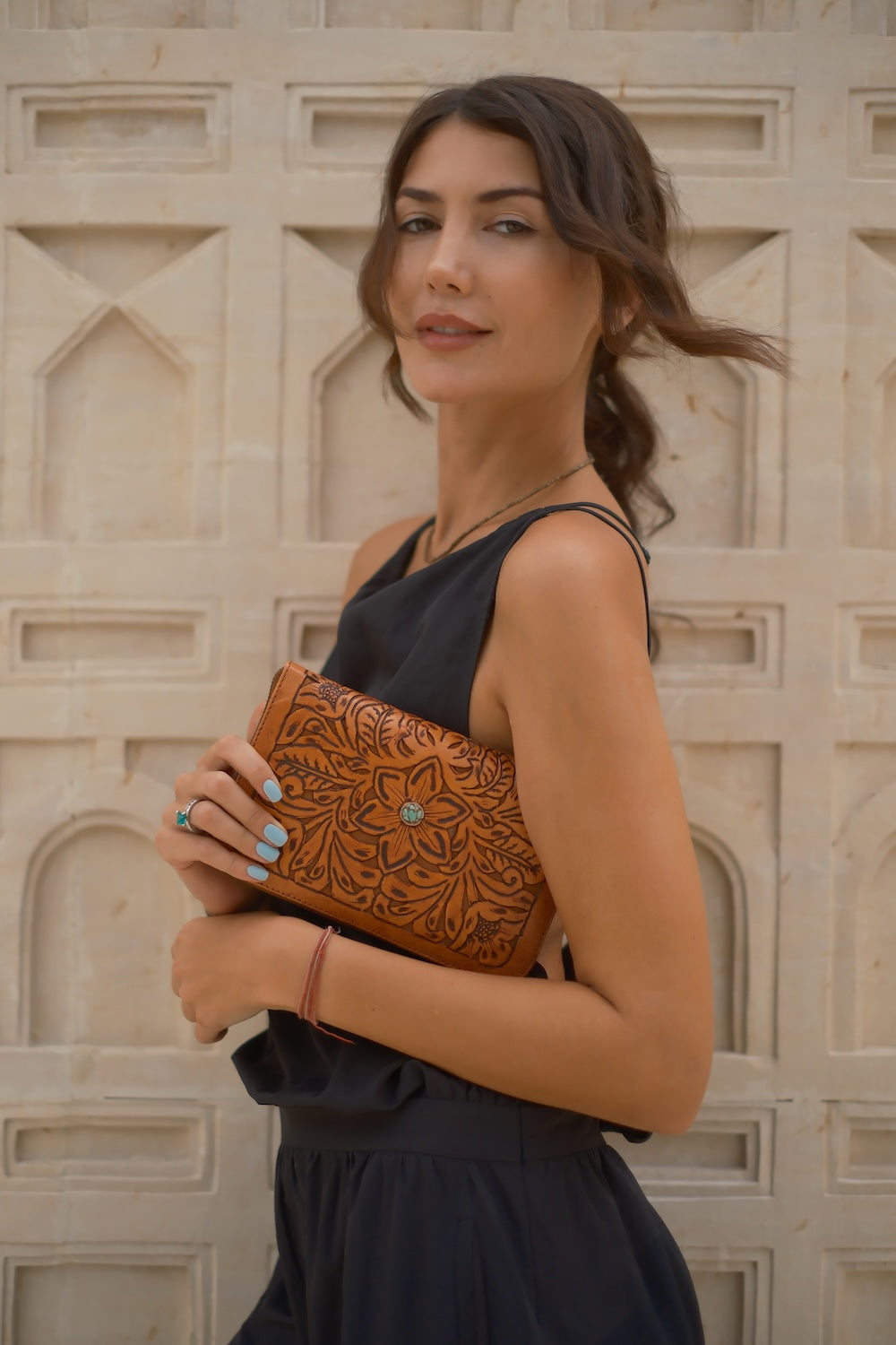 Artisan tobacco brown leather wallet with hand‑tooled design, zip closure, card slots, and detachable tassel, ethically made in Australia.