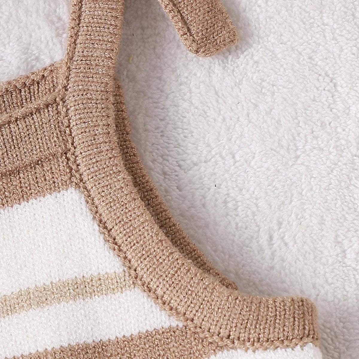 Baby in Chocolate Striped Frilly Knit Romper Playing Outdoors: A baby girl enjoying a sunny day while wearing the chocolate striped romper with ruffle legs.