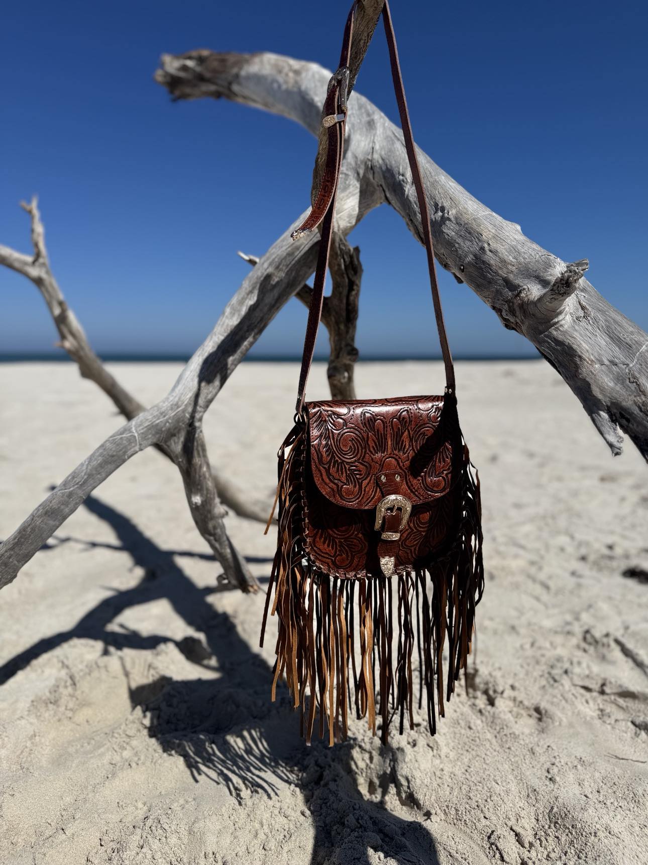 Bohemian Brown Leather Fringe Bag: The Feyre bag from House of Hide, showcasing its free-spirited design and movement of the fringe.