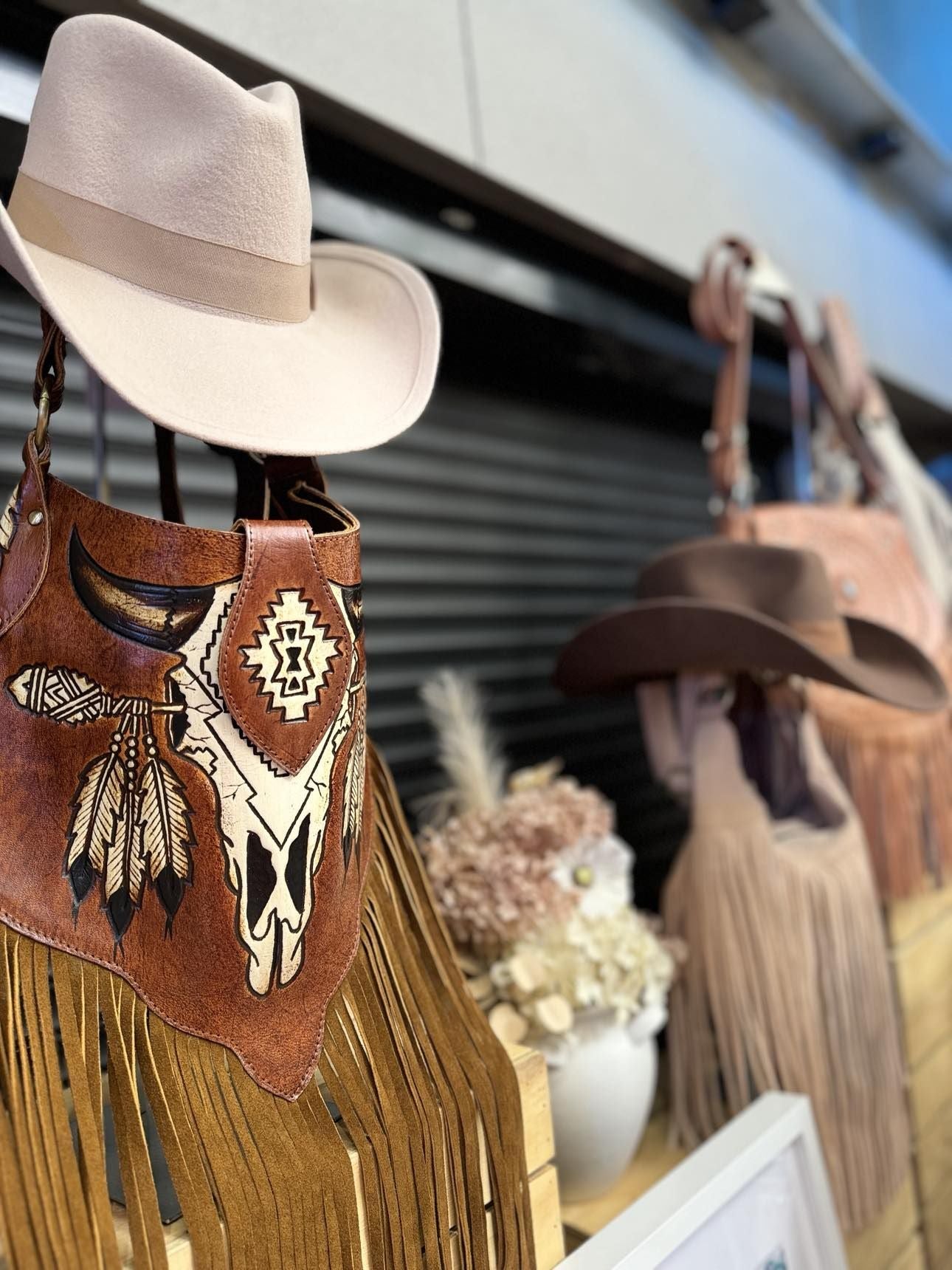 Close-up of intricate carving and tassels on the Boho Bronco Bag – slow fashion meets country chic