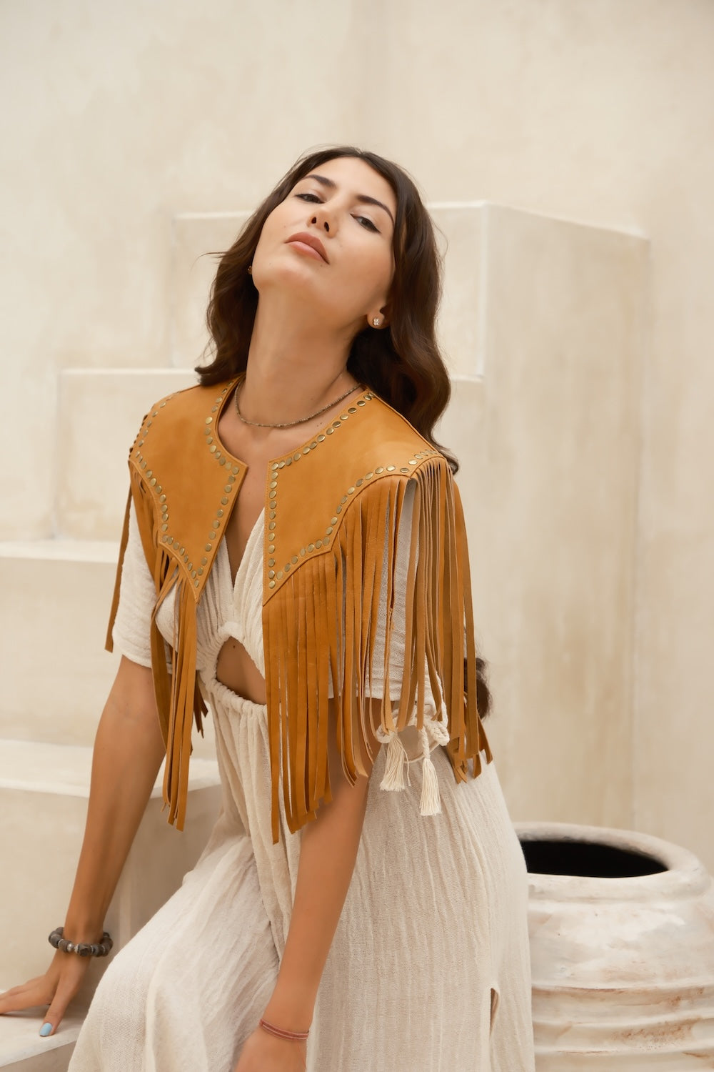 Boho Western tan leather bolero without collar or star motifs. Tan cowhide fringe bolero with stud detail, styled as western rodeo wear in Australia.