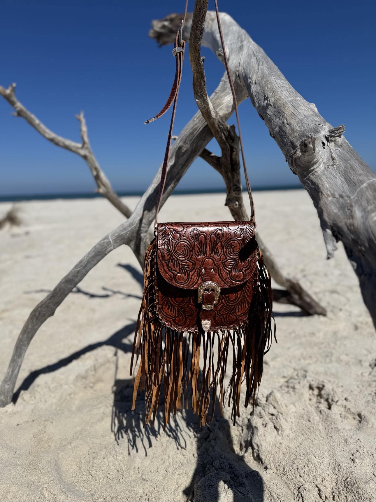 Brown Leather Bag with Long Fringe: A statement piece from House of Hide, the Feyre bag with its dramatic, eye-catching fringe detail.