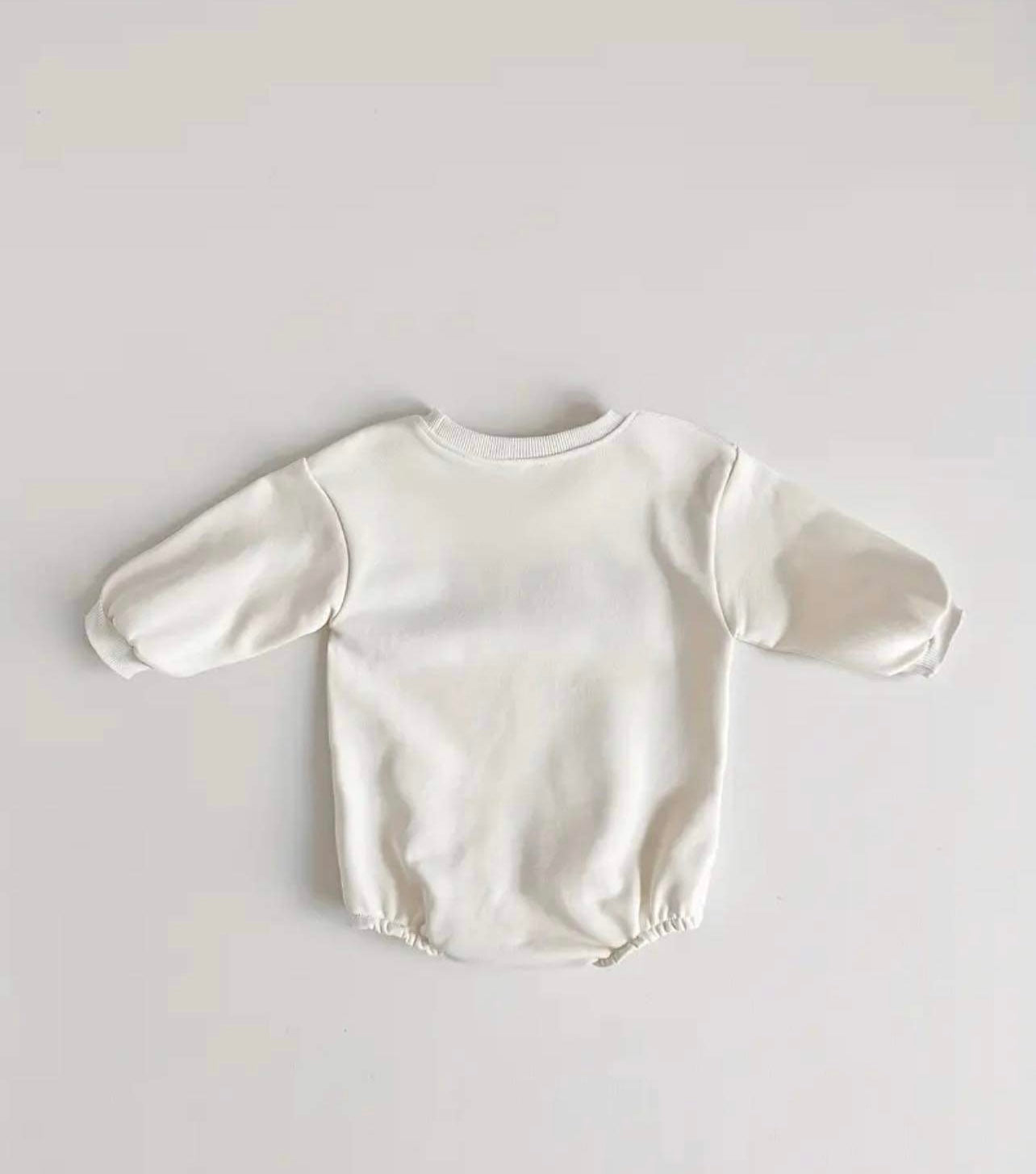 Cosy cotton and polyester baby romper in pink with pullover design.
