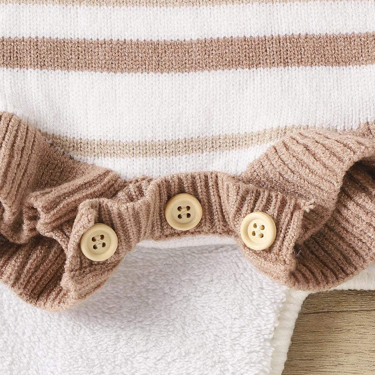 Flat Lay of Chocolate Striped Frilly Knit Romper with Bottom Buttons: The romper laid flat to highlight the stripe design, bottom buttons for easy diaper changes, and soft knit material.