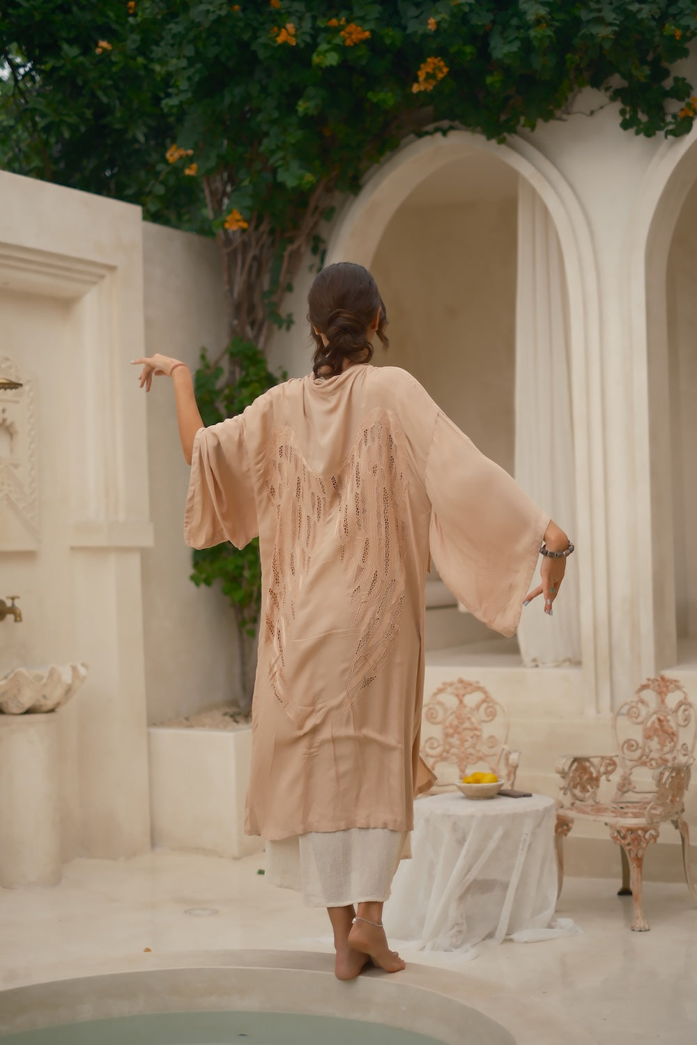 Flowing bohemian kimono in apricot and white, styled for summer