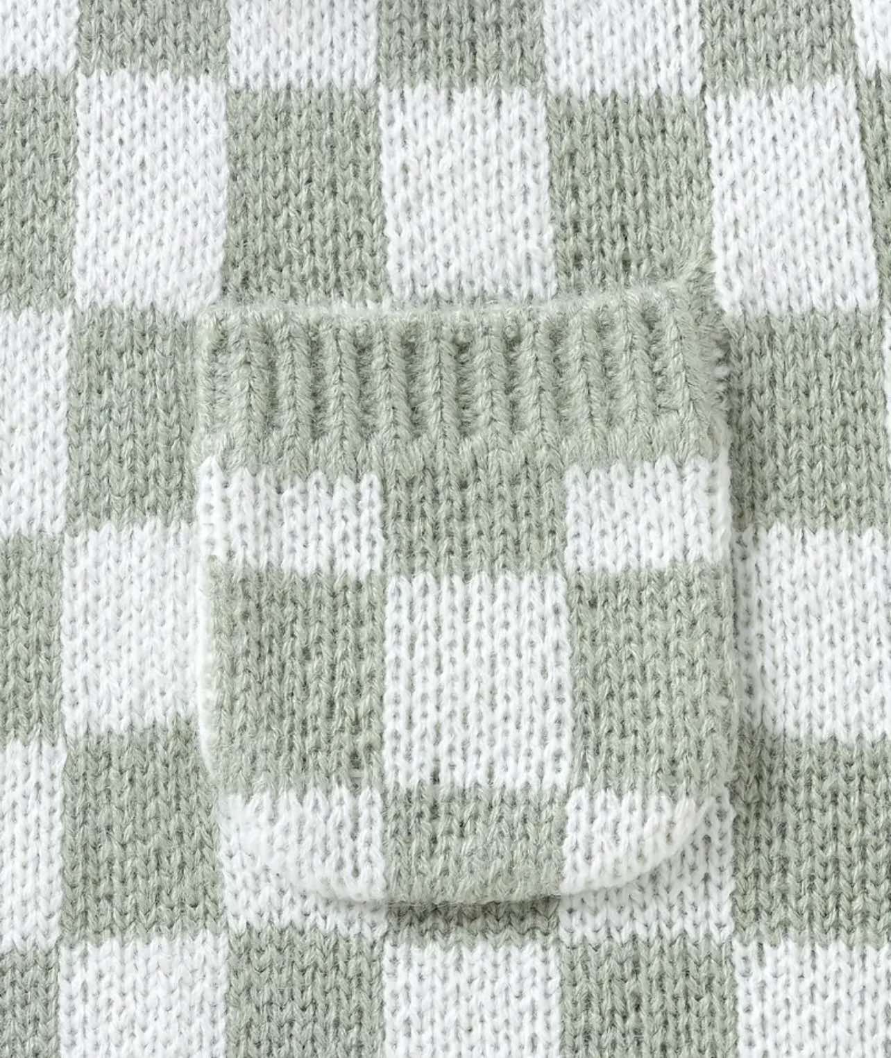 Green knit jumpsuit for baby, featuring medium-stretch fabric and a functional front pocket."