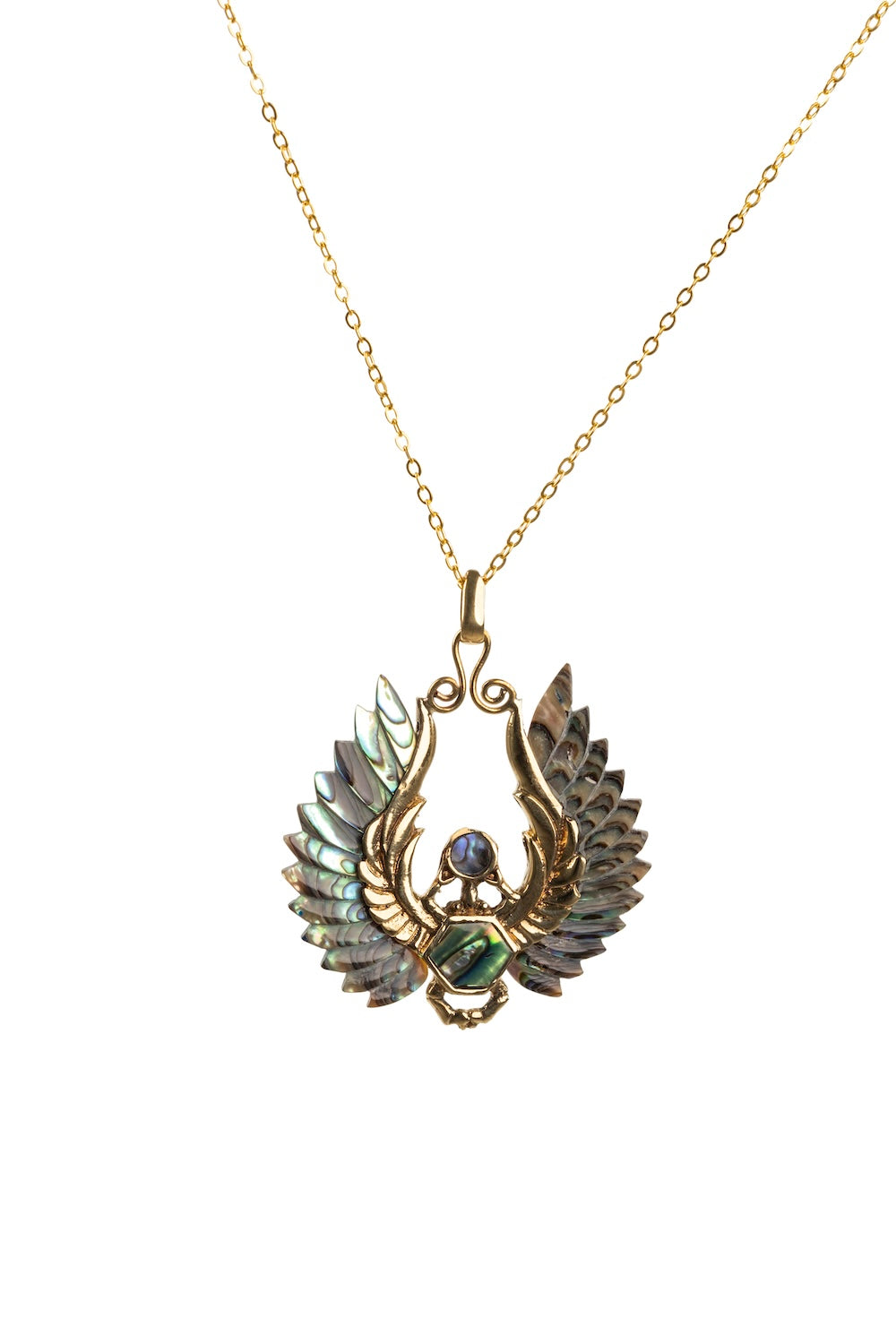 Gold-tone angel wing necklace with carved paua shell wings. Lightweight, symbolic, and full of natural iridescence and coastal charm.