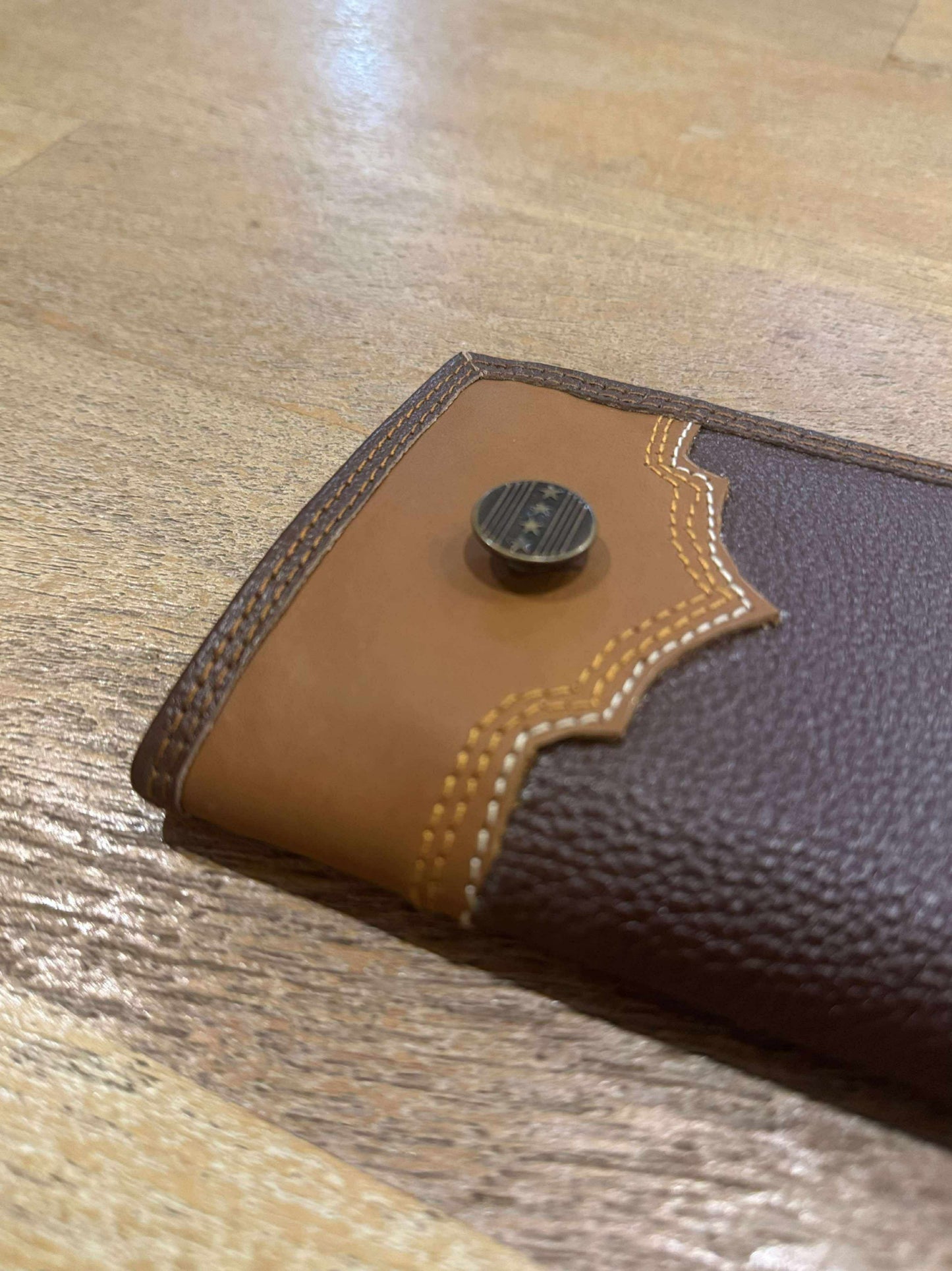 Handmade women’s Rodeo Wallet crafted from cowhide leather with embroidered details, Western concho, and RFID protection – rustic and boho-inspired.