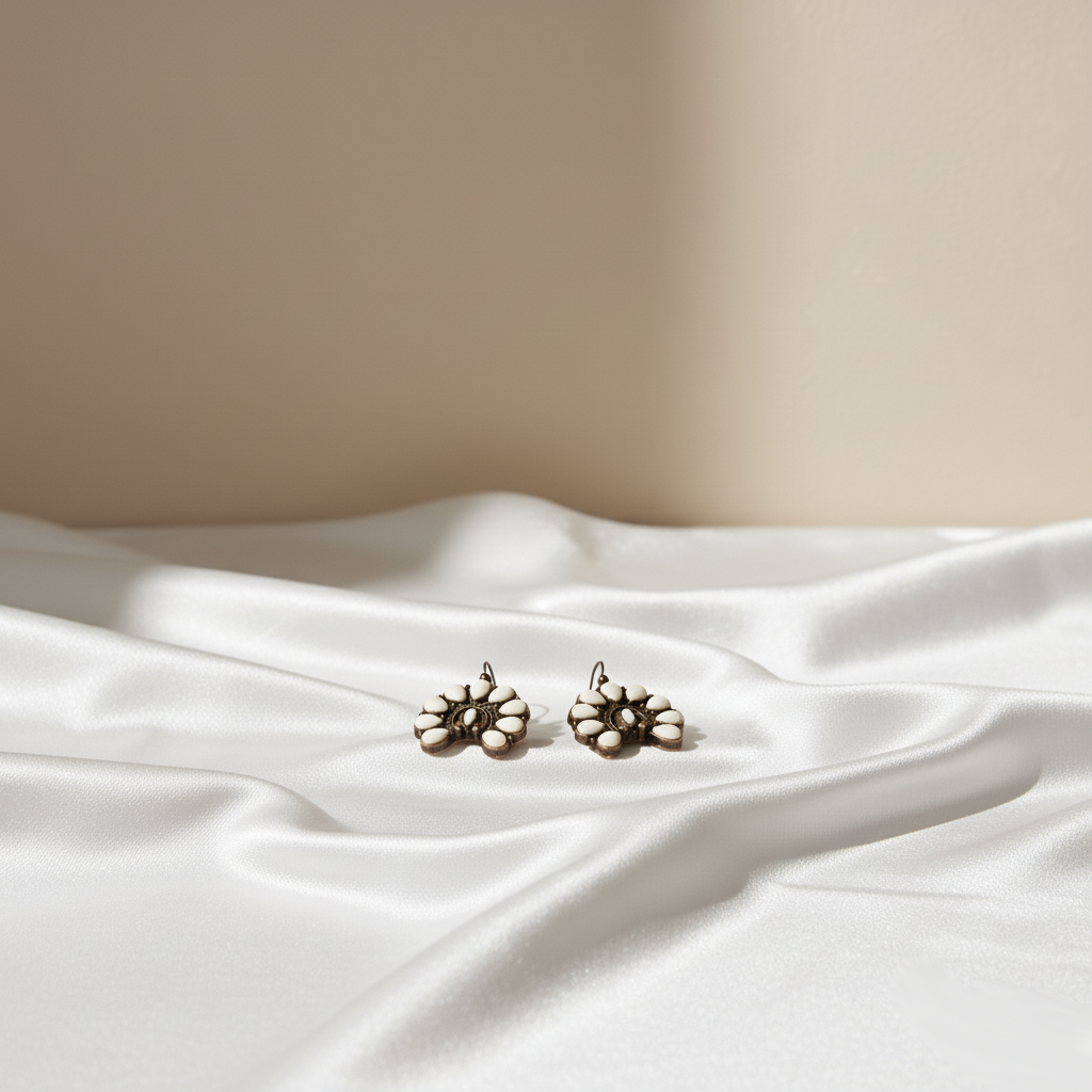 Havana Pearl Bloom Earring Perth Australia Houseofhide photographed in soft light revealing intricate silver craftsmanship.