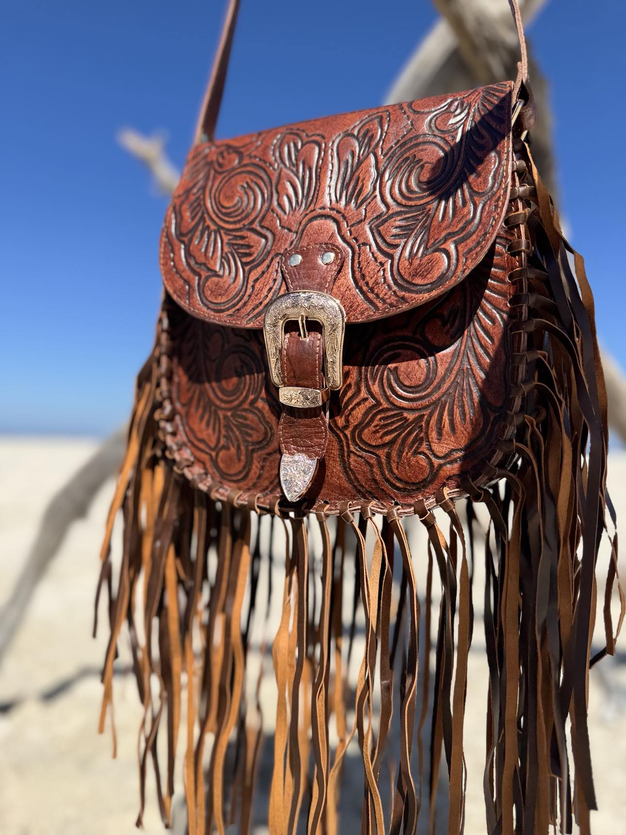 Tooled Leather Crossbody Bag with Fringe: Intricate leather detailing on the Feyre bag, highlighting the craftsmanship of House of Hide.
