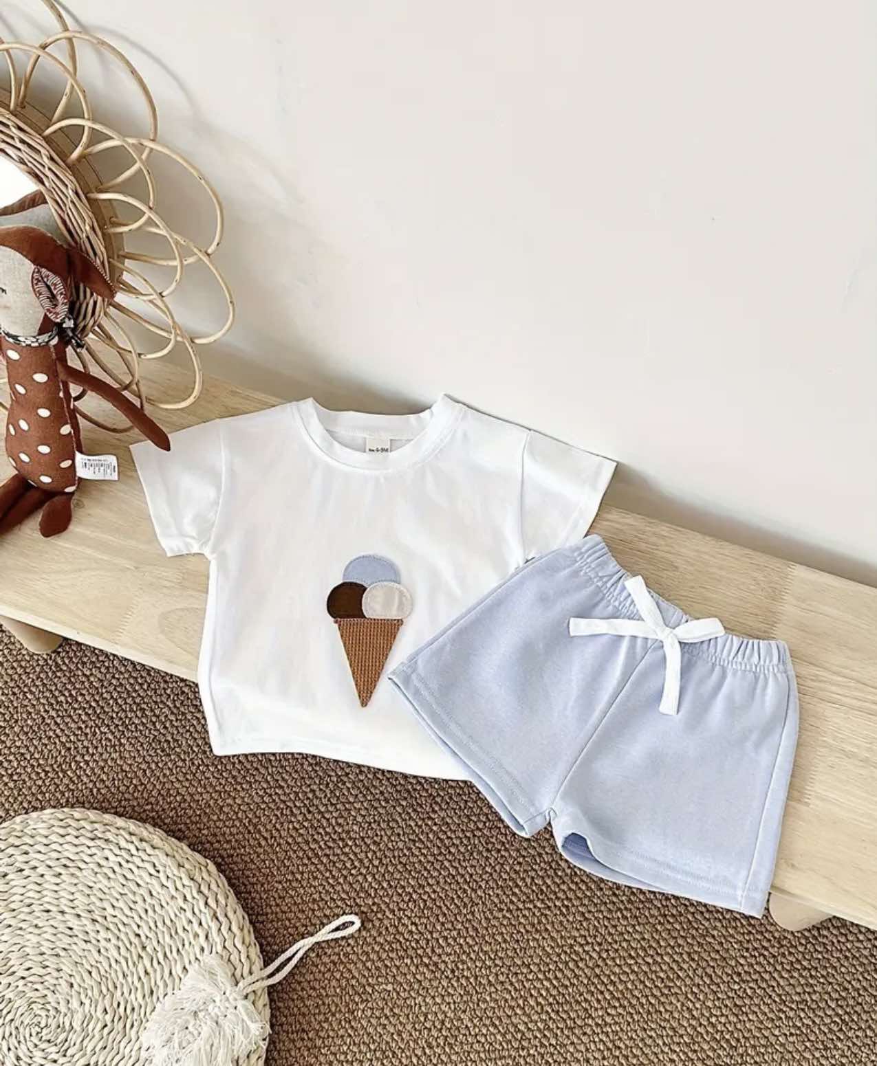 Trendy summer kidswear in Australia: white ice cream tee with pastel blue shorts