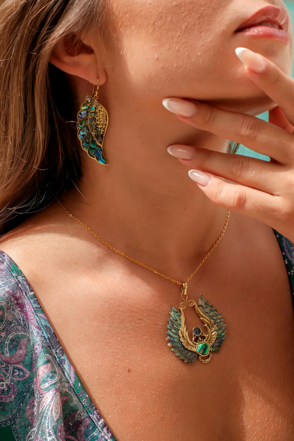 Tribal eagle wing earrings in shimmering shell and brass