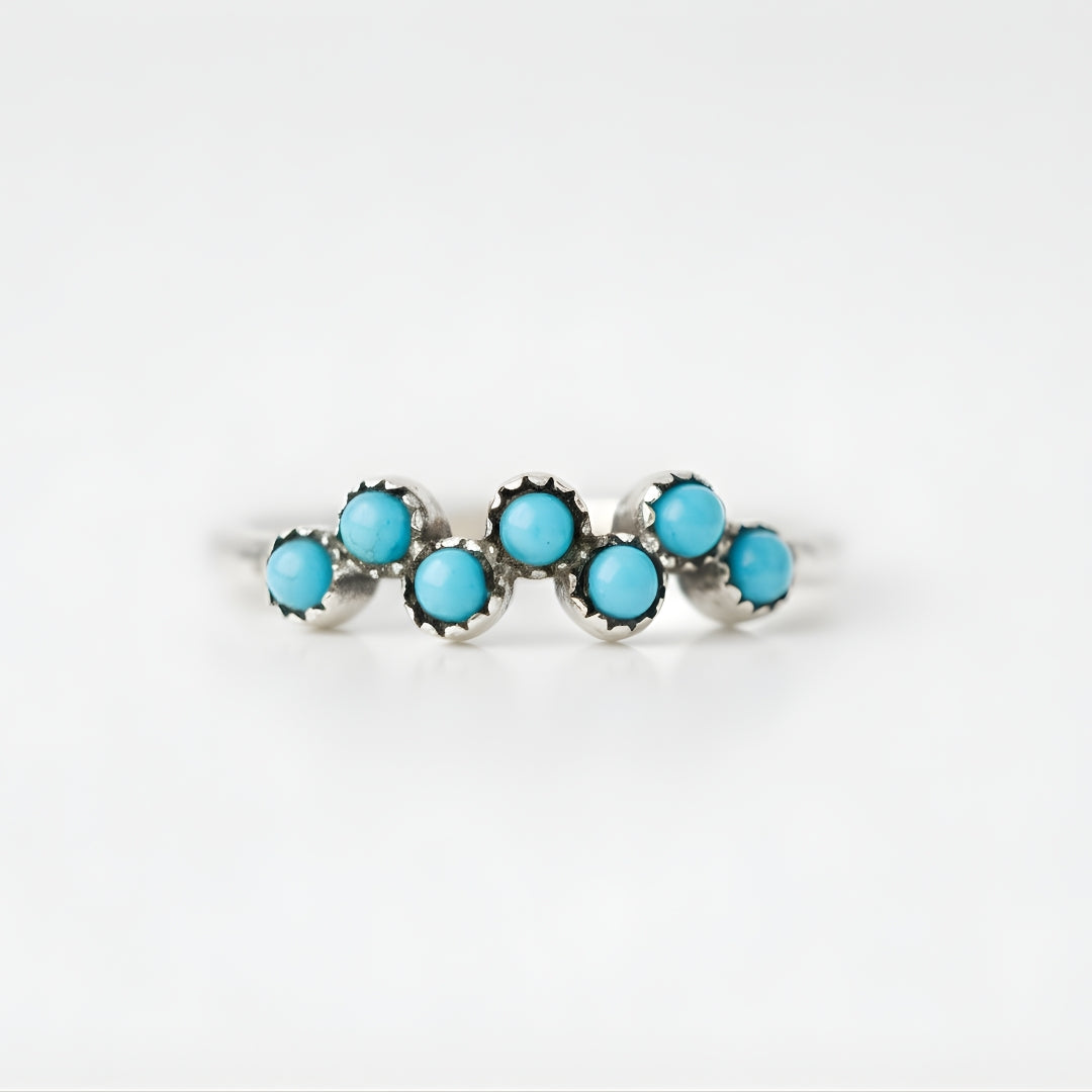 Silver ring with turquoise stones by House of Hide jewellery, designed in Perth, Australia on a white background