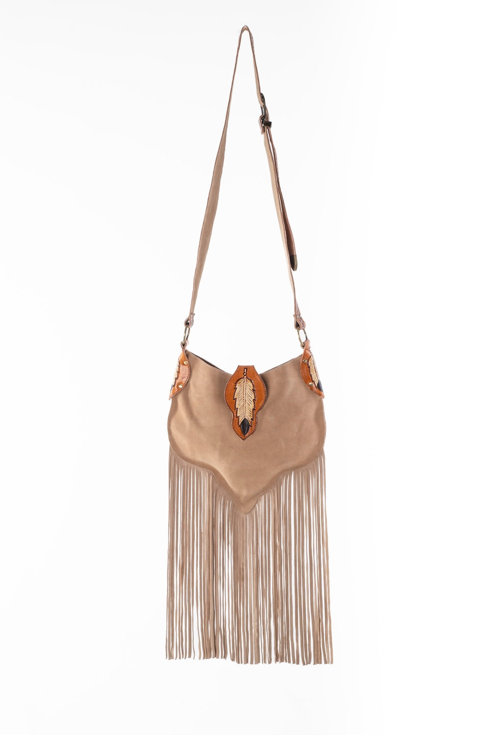Western-inspired tan leather fringe bag with adjustable strap, floral tooled details, and spacious compartments.