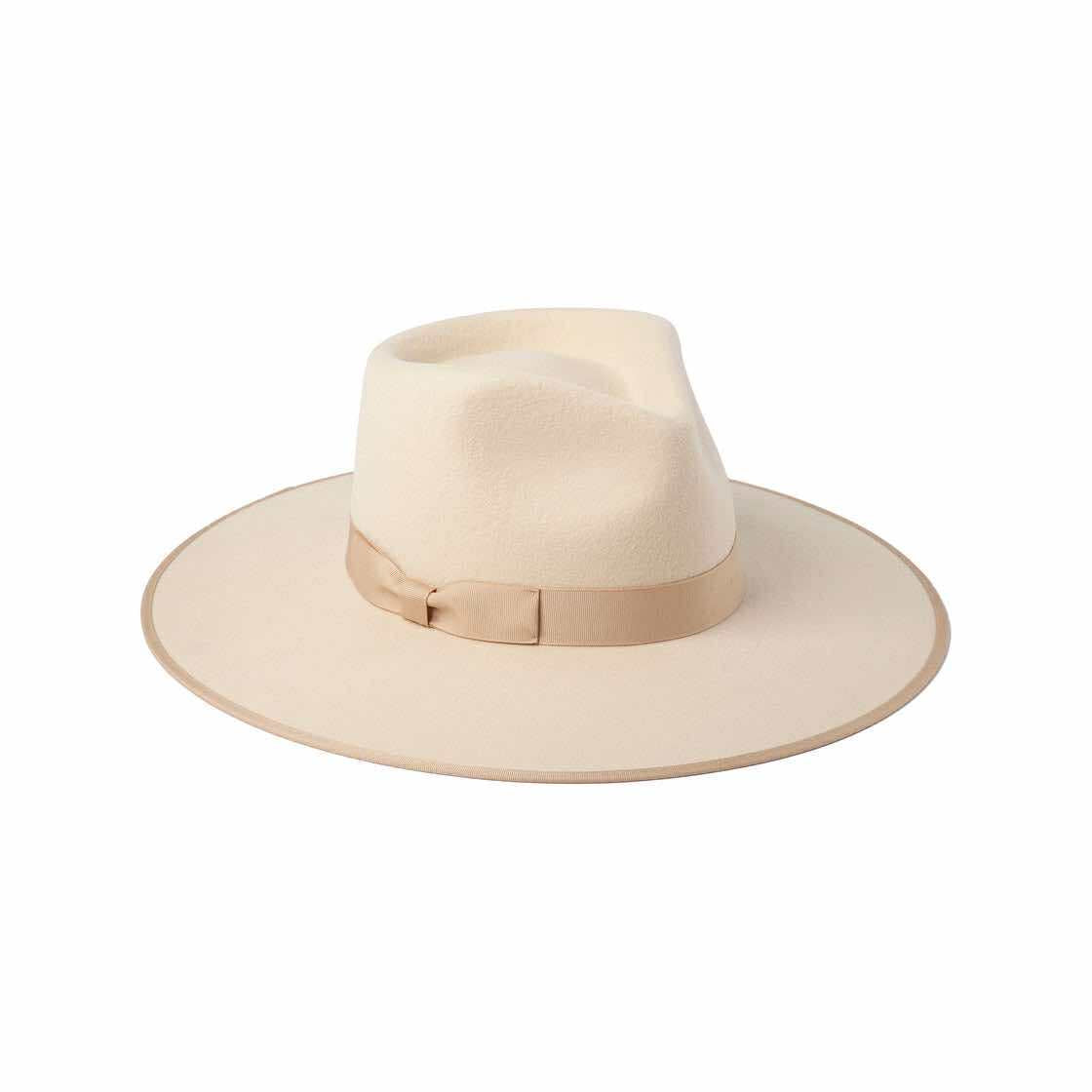 Wide brim fedora hat made from 100% Australian wool in soft cream, styled outdoors.
