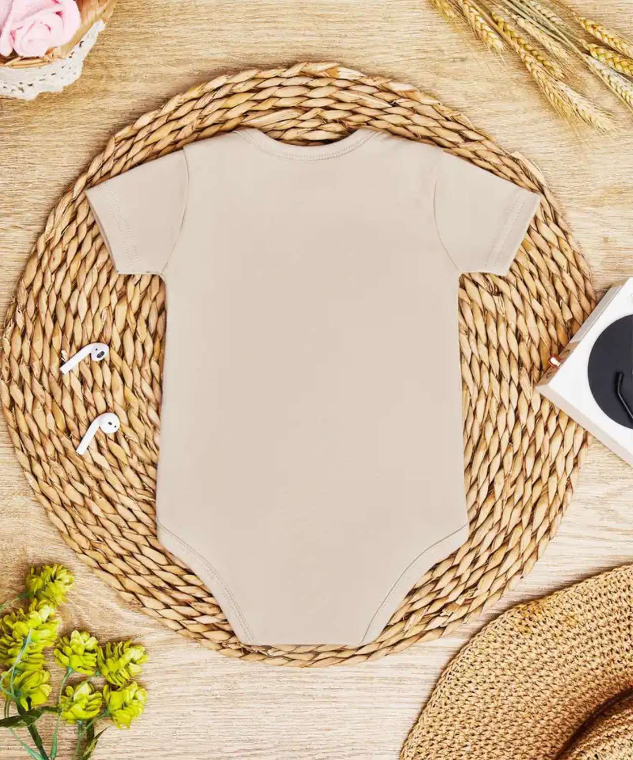 Smiling baby dressed in a ranch-themed onesie with "Future Gate Opener" printed on the front.