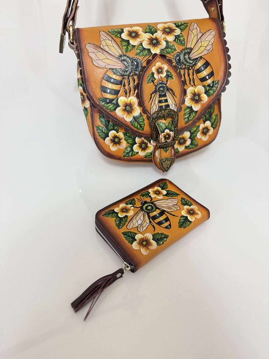 Handbag and wallet with bee and floral design on a white background