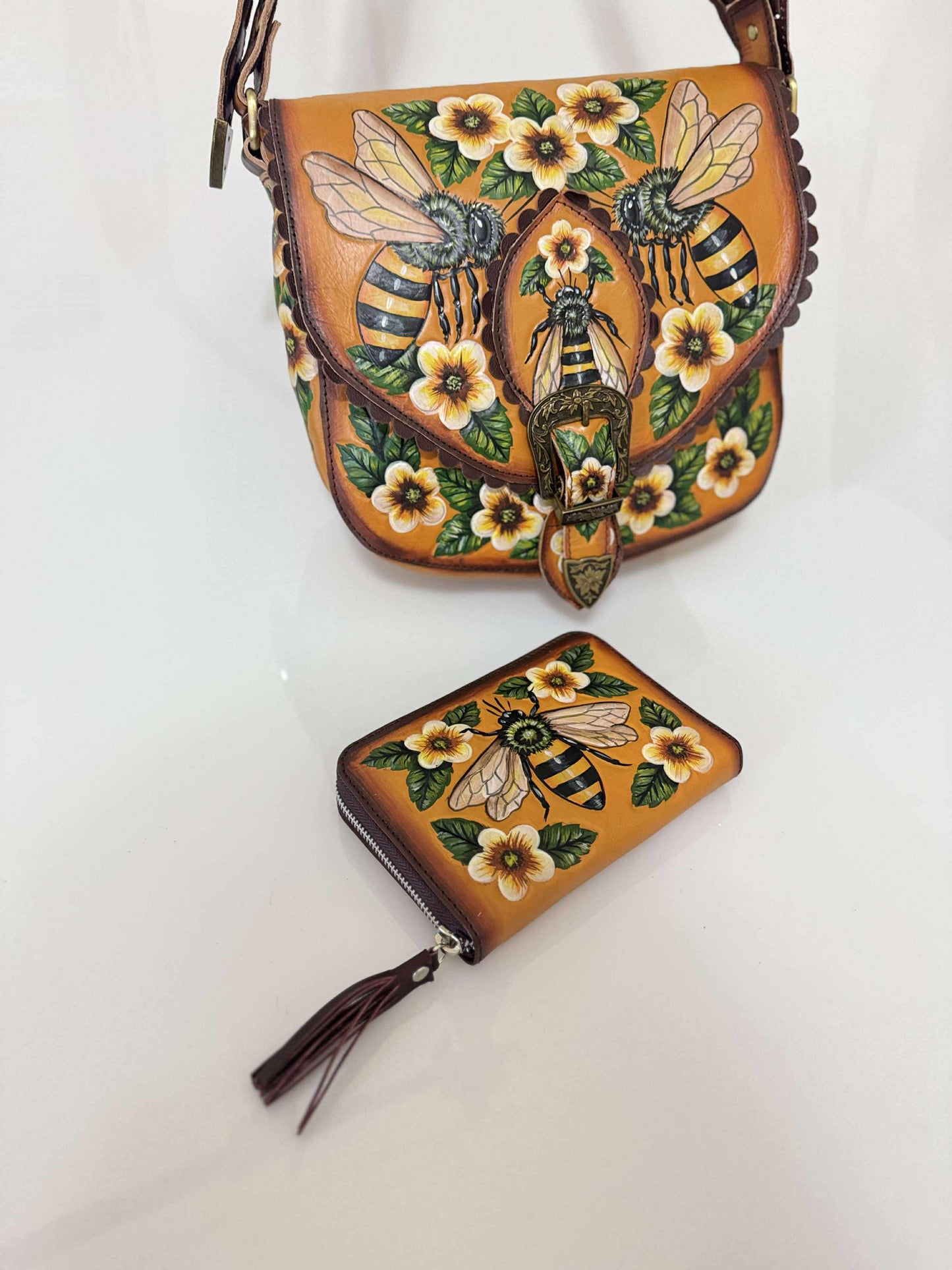 Handbag and wallet with bee and floral design on a white background