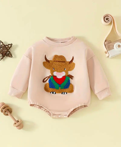 Close-up of the soft cotton fabric and embroidered bull design on the Behind the Bull romper, showcasing high-quality craftsmanship and Western charm.
