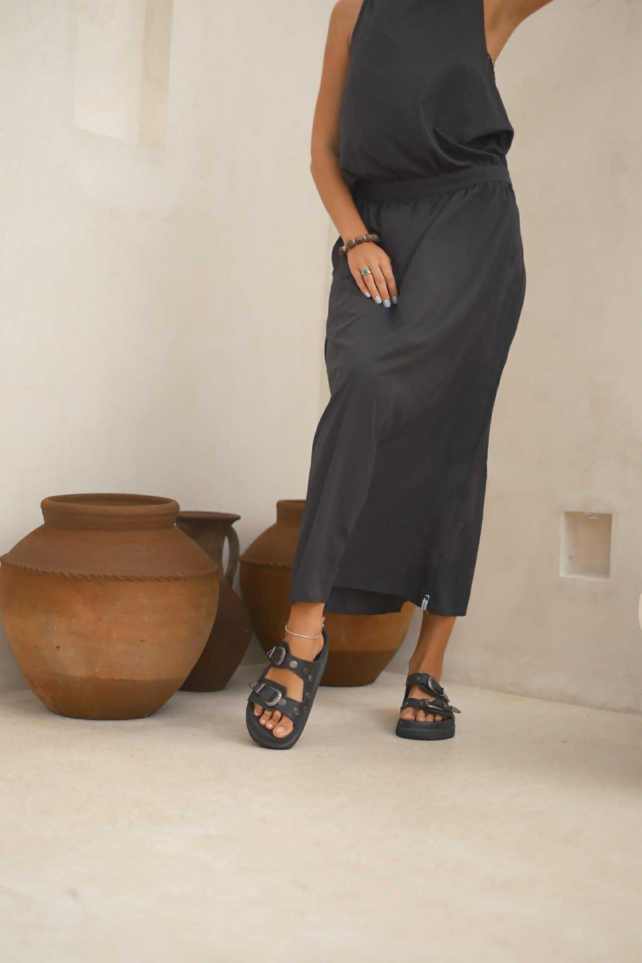 Australia-designed black leather sandals blending Birkenstock practicality with western edge