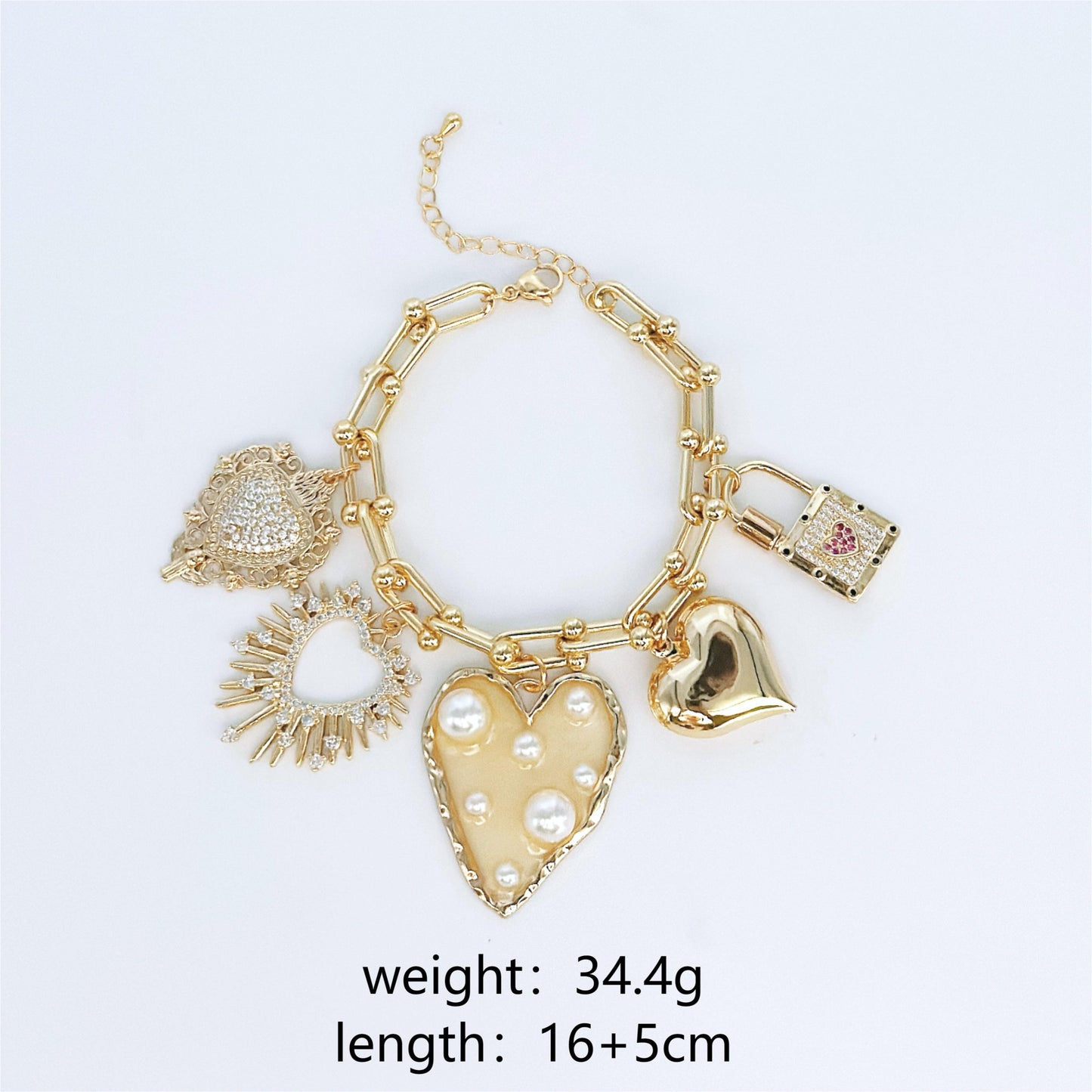 Gold bracelet with heart-shaped charms on a white background