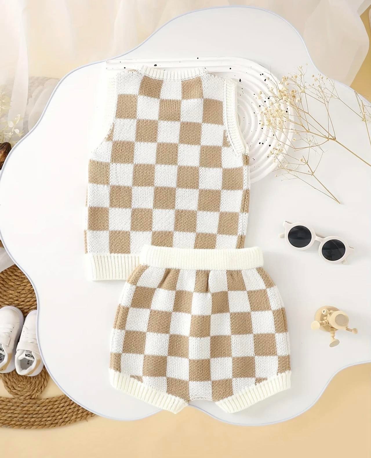 Close-up of soft and lightweight knit fabric in a checkered pattern, ideal for keeping toddlers and infants cool in summer.