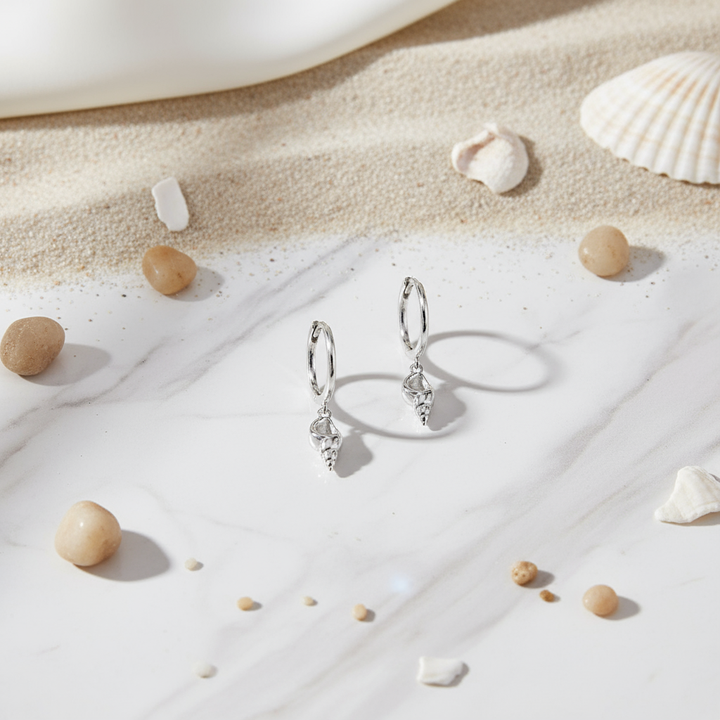 Polished silver shell hoop earrings – ocean-inspired accessory by Houseofhide Perth