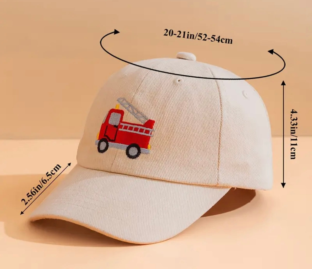 Front view of the vibrant kids' firetruck hat, complete with a bold fire engine design and a bright red brim