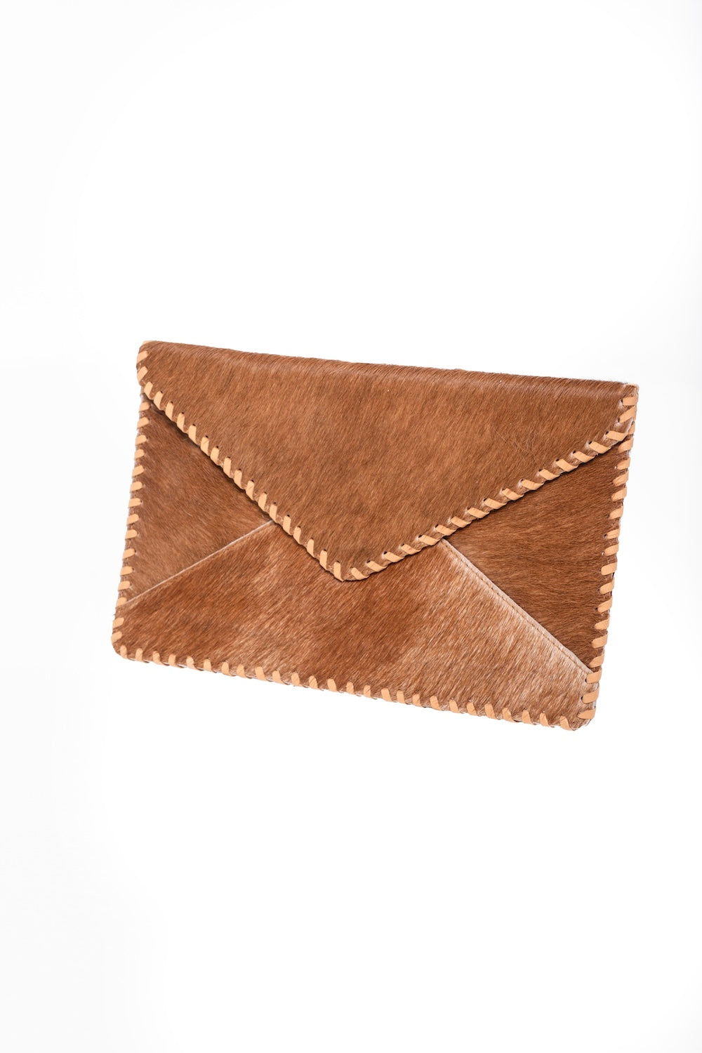 Handmade natural grain tan cowhide clutch purse, envelope design with faux suede lining and rustic artisan stitching.