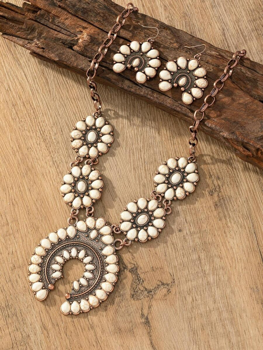 Rustic rodeo jewelry set sideview, antique copper squash blossom necklace and earrings, white stone statement jewelry.