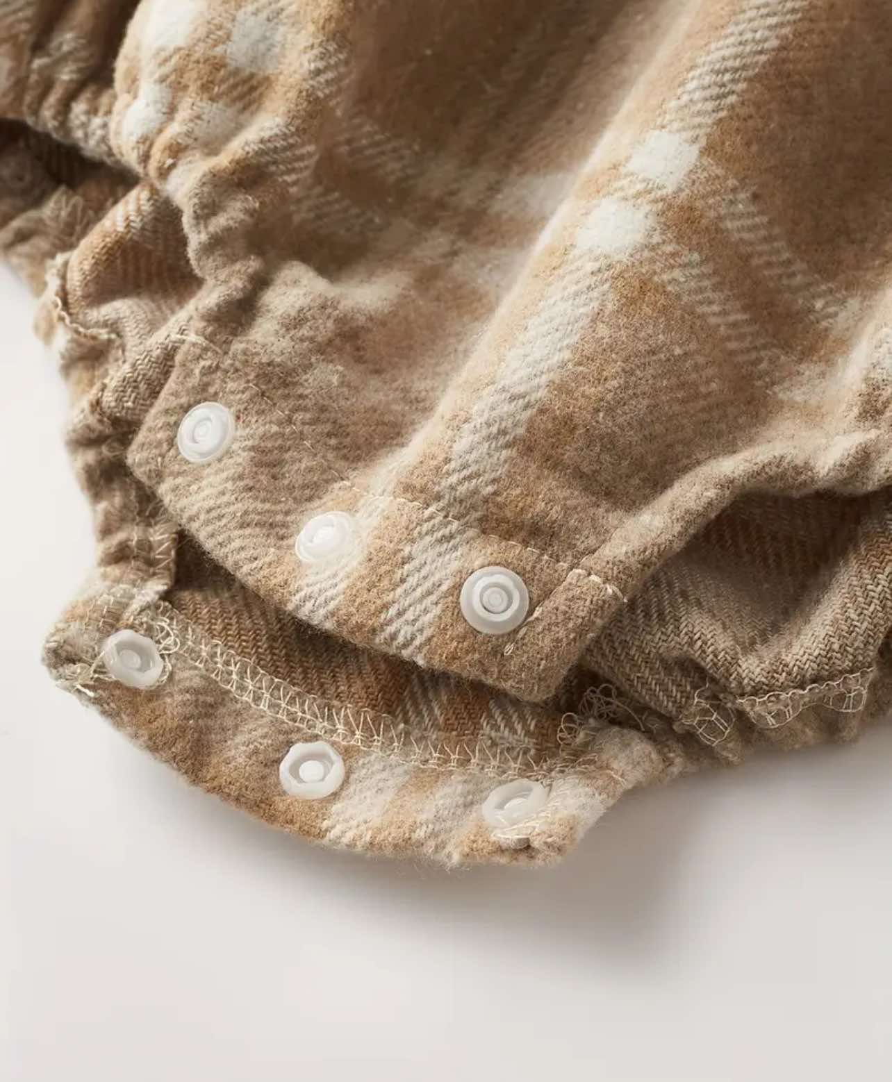 Warm flannel baby romper for fall and winter, featuring snap buttons for convenience.