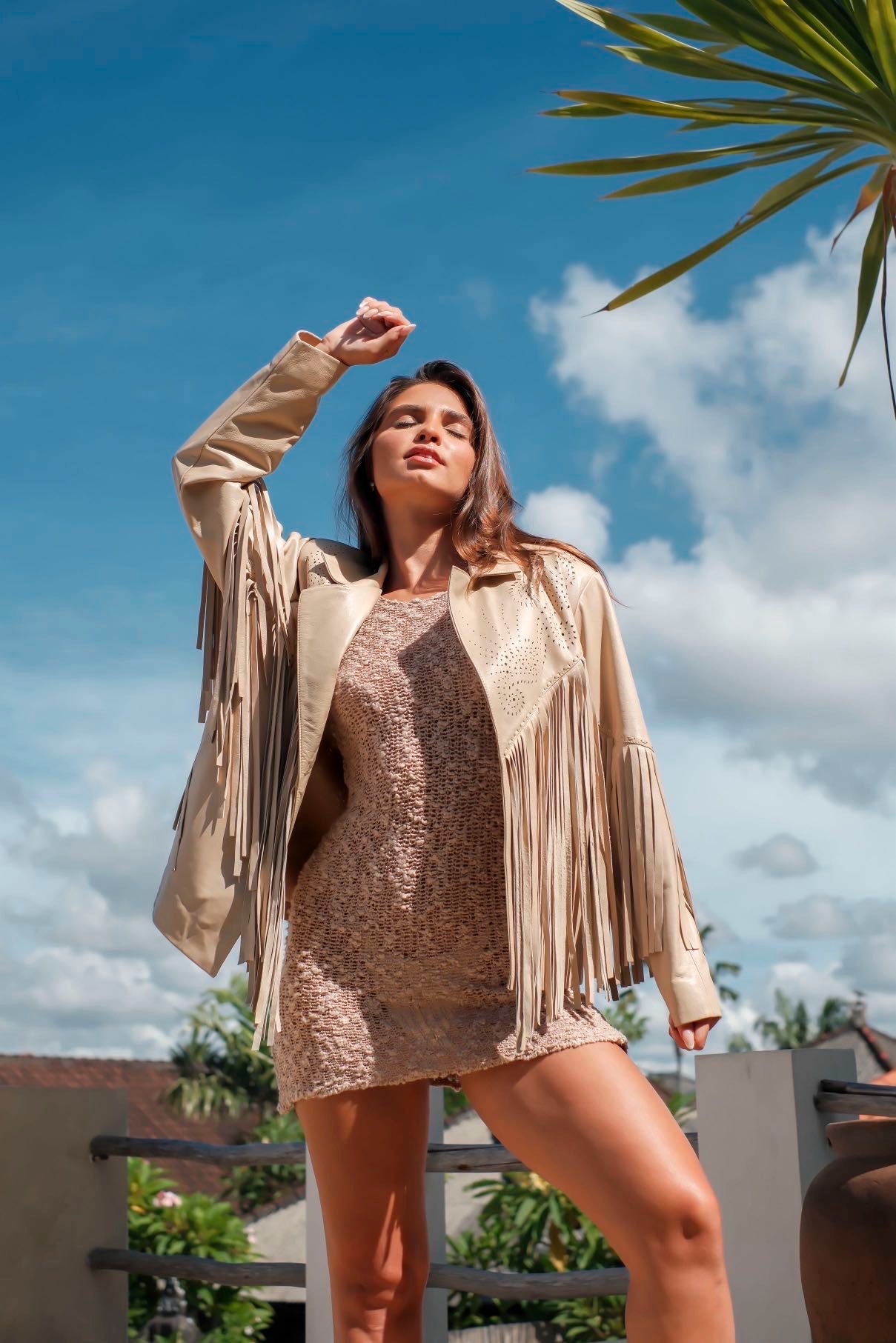 Close-up of western fringe jacket showing detailed cutwork and buttery leather texture