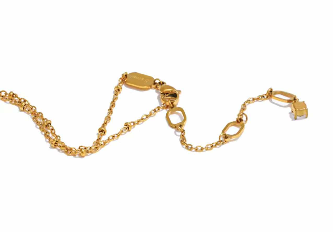 Minimalist country-boho necklace with gold beading and twinkle stone details
