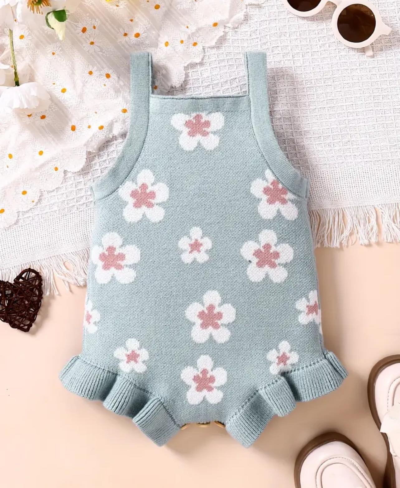 Adorable floral baby romper – Soft, breathable knit with ruffle trim for a perfect summer look.