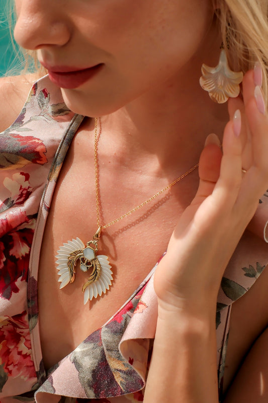 Angel wing pendant necklace with carved shell wings