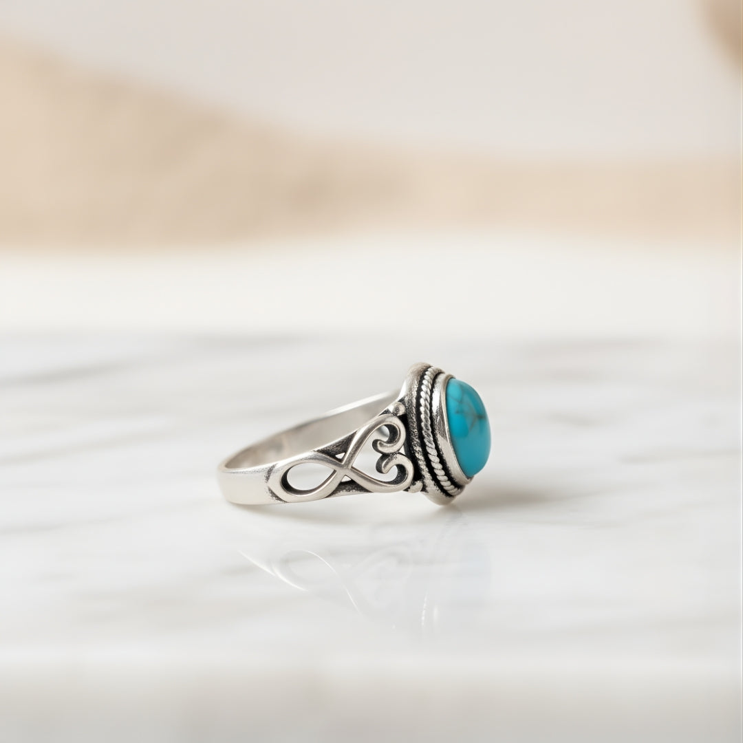 Aqua Sol Ring displayed on white surface elegant turquoise and silver design