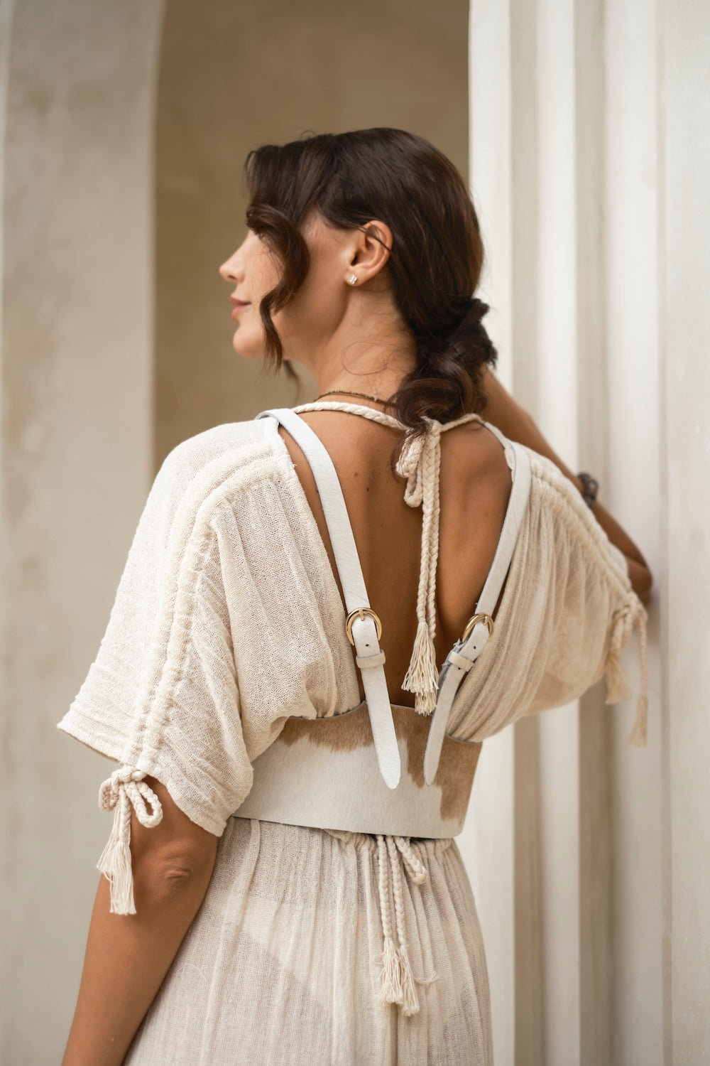 Artisan cowhide harness made from genuine leather with natural patterning.