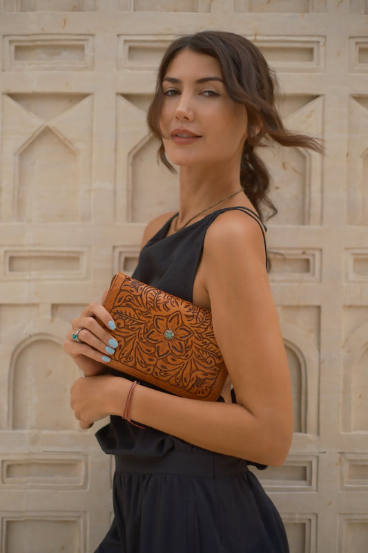 Artisan tobacco brown leather wallet with hand‑tooled design, zip closure, card slots, and detachable tassel, ethically made in Australia.