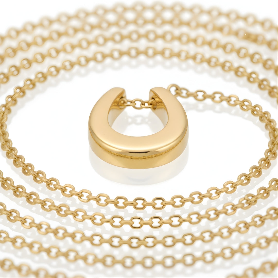 Close-up of Aurea Horseshoe Necklace Perth Australia Houseofhide showing mirror-like gold finish and delicate craftsmanship.