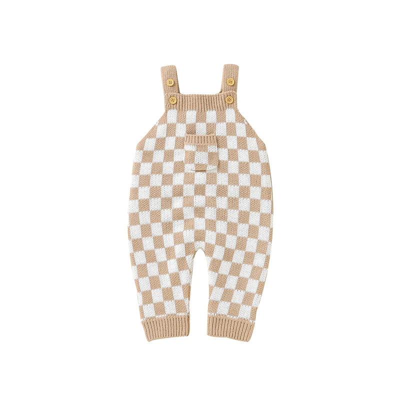 Baby girl beige and white checker pattern knit jumpsuit with flap pocket and strap shoulders.