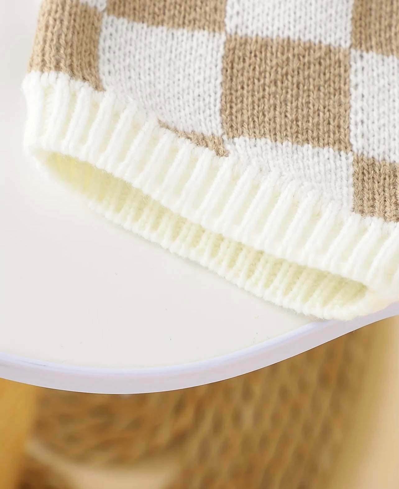 Baby's Checkerboard Pattern 2pcs Knitted Outfit laid flat, showing the sleeveless vest and shorts in a cream and coffee color scheme.