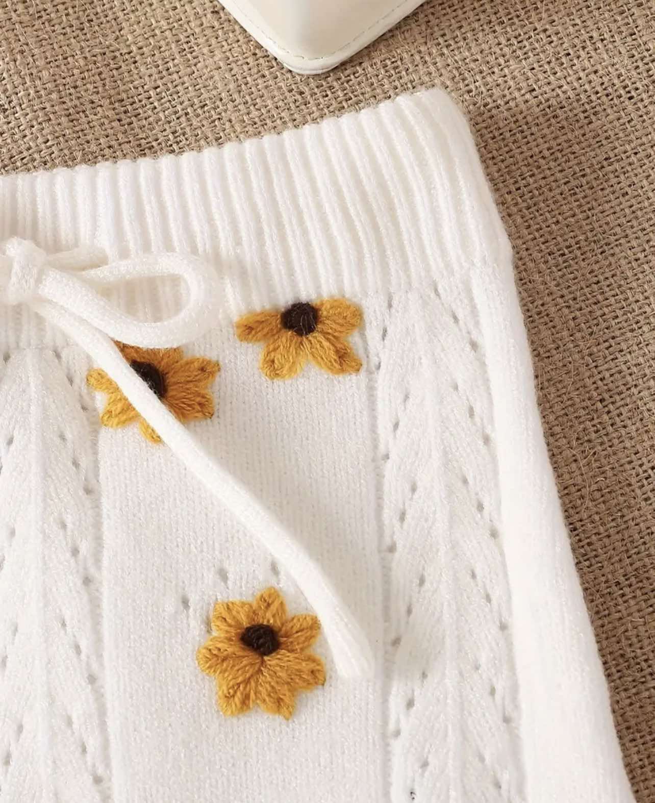 Baby wearing the White Sunflower Knit Two-Piece Set, featuring tie-strap tank top and matching shorts, sold in Australia.