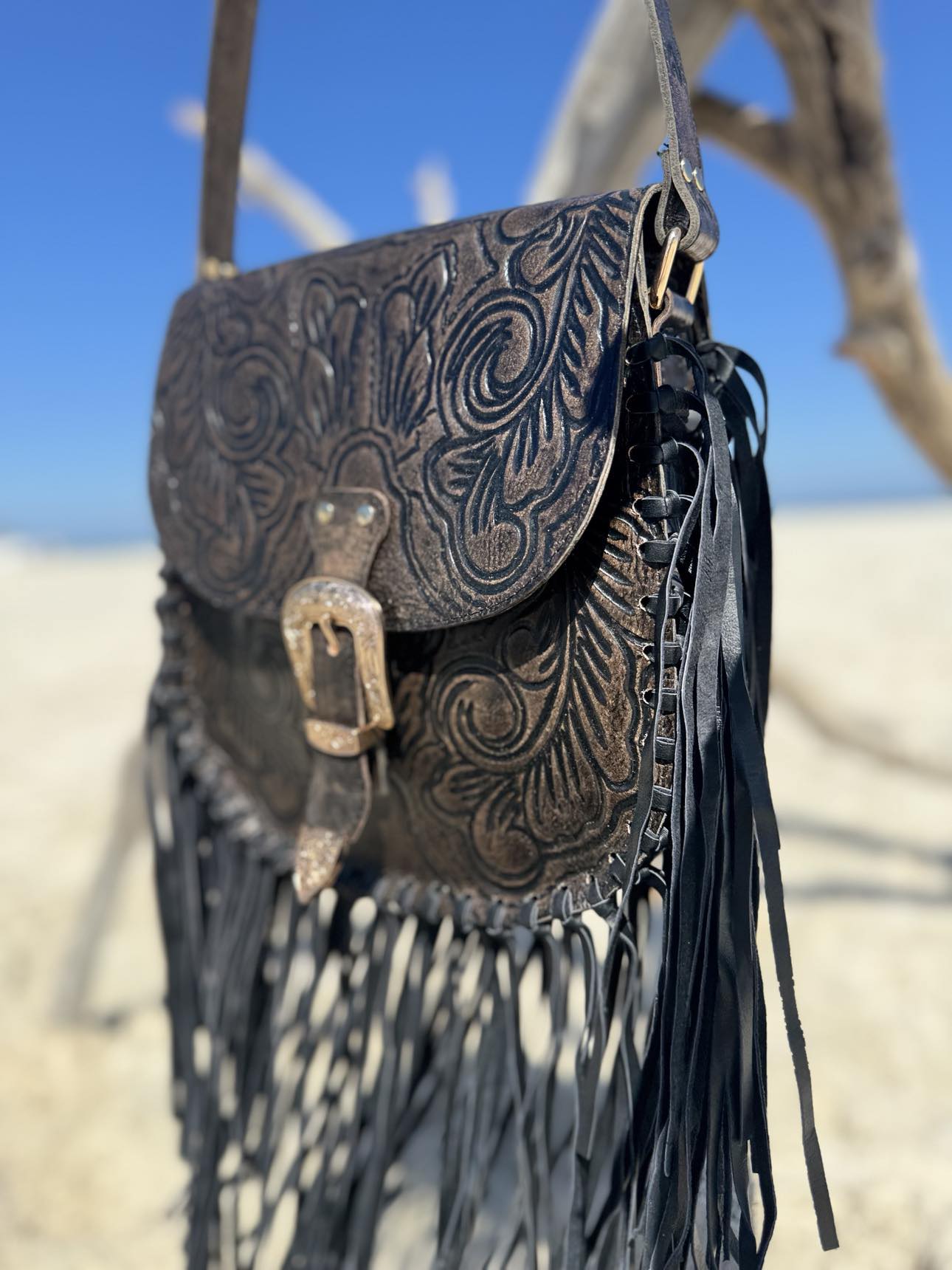 Back view of the Blackstone Crossbody with adjustable strap, offering a stylish yet functional design.
