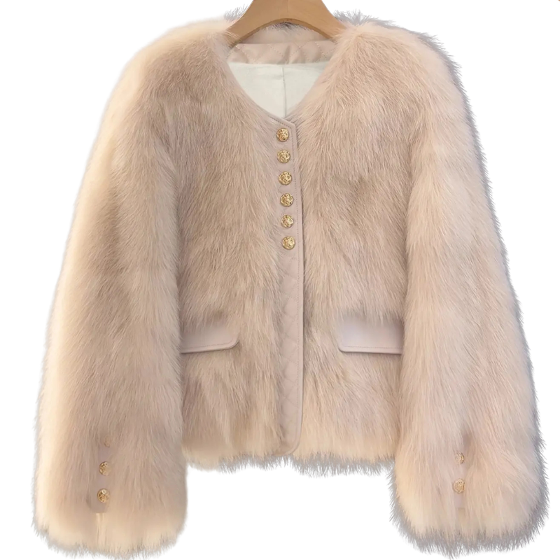 Bailey Jacket from House of Hide in plush beige faux fur with gold button closures, vegan leather placket and pocket trim, full voluminous sleeves, cropped boxy silhouette being displayed hanging on wooden hanger against clean white background