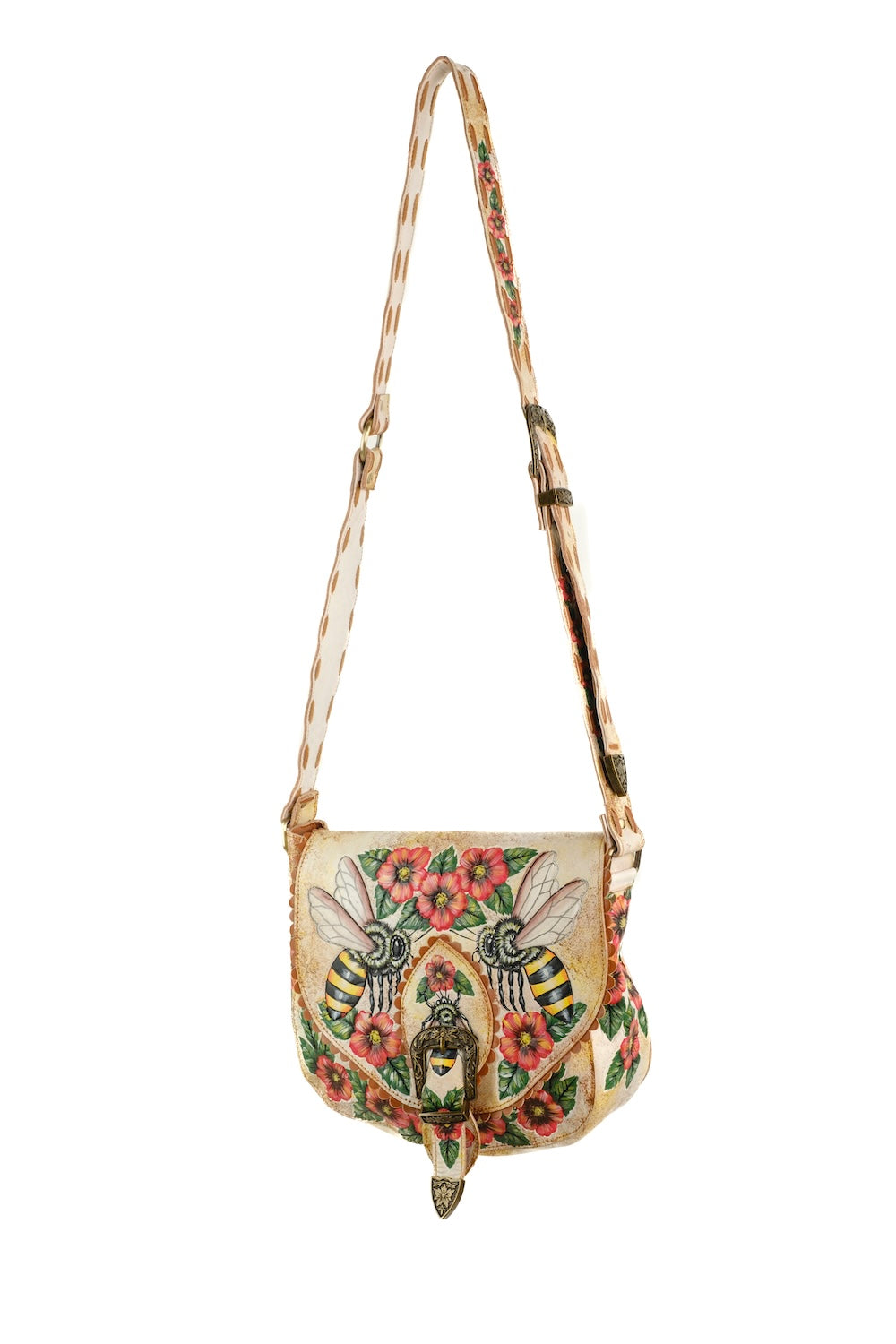 Hand-tooled leather crossbody bag with bee and floral design lifestyle photo