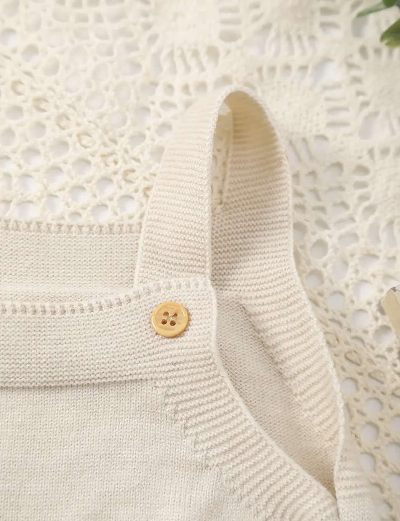 Beige baby romper with soft knit texture and cute lamb design, styled for spring and farm vibes