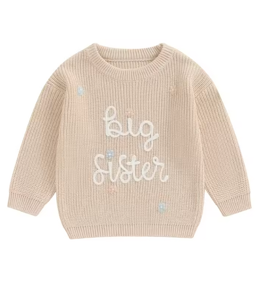Toddler girl in beige Big Sister knit jumper
Big Sister jumper in beige with colourful embroidery