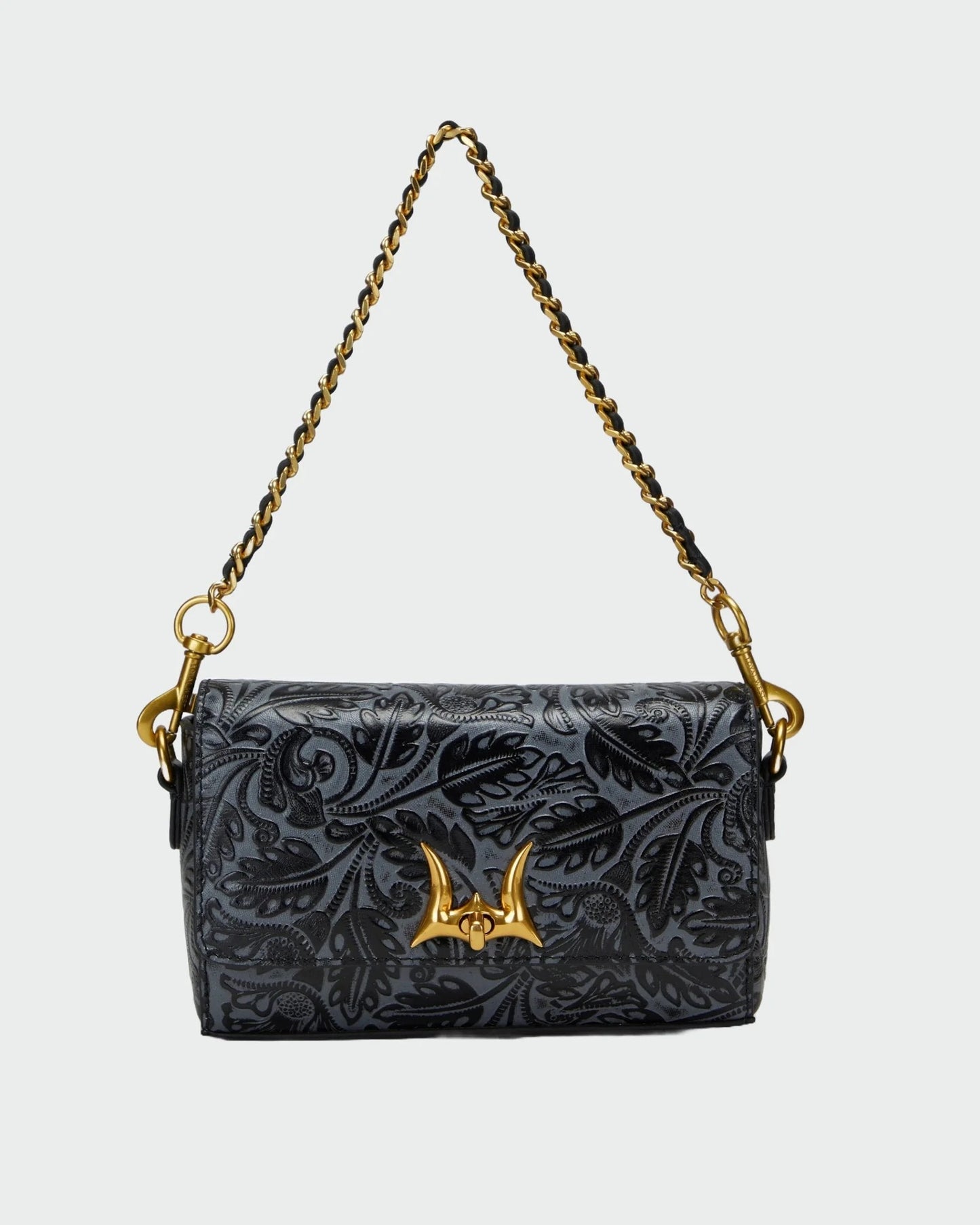 House of Hide genuine leather black floral-patterned handbag featuring a gold-tone chain strap on a light gray studio background