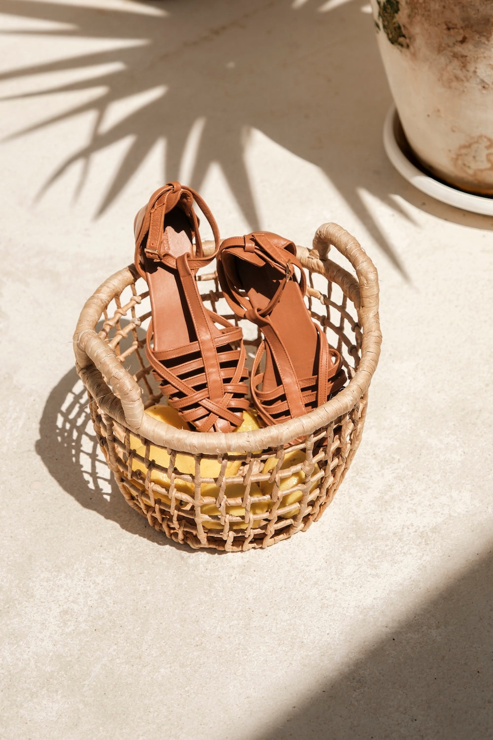 Boho-style closed toe leather sandals for women with flat sole, perfect for summer travel, markets, and casual wear