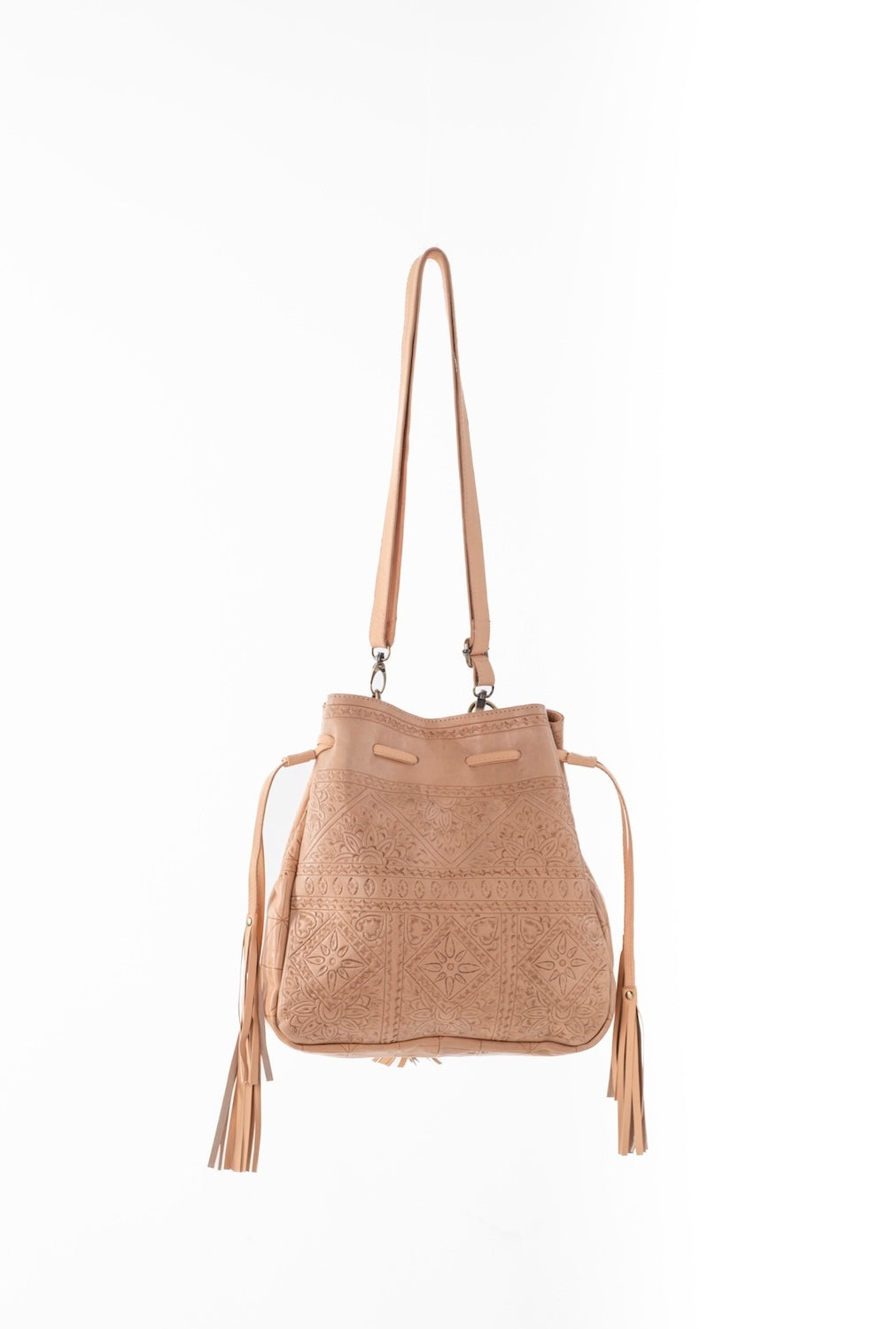 Boho-style leather bag styled with denim and boots